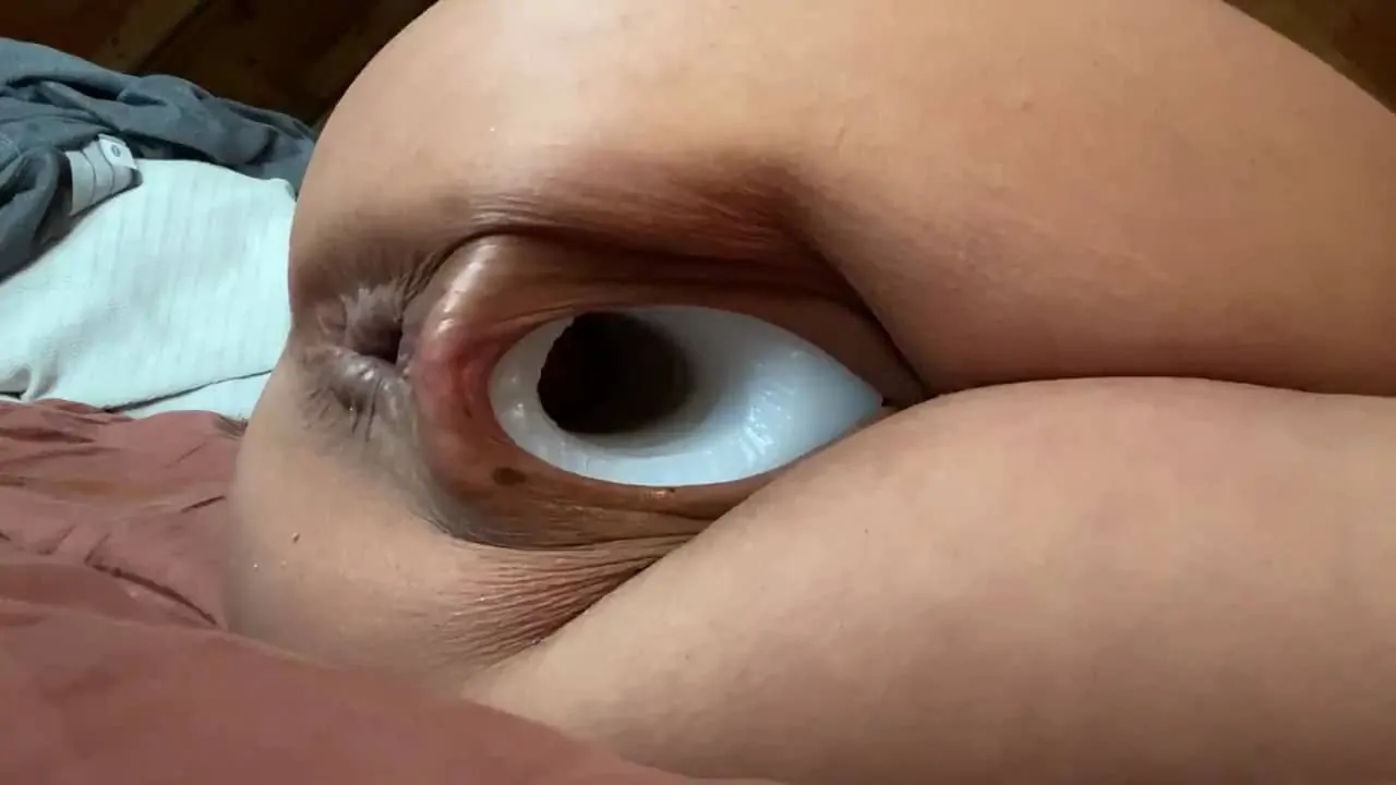 Qweenselene playing with a pighole toy